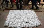 Guy Fawkes masks are seen on the ground as anti-government protesters gather in Istanbul's Taksim square